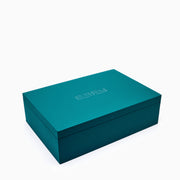 Effy Signature Jewelry Box with 7-piece removable inserts in teal velvet features organized compartments, removable trays, a pillow, and a round section. Open the box to display versatile storage options, with the ESPY brand name elegantly embossed inside the lid.