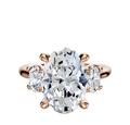 An 18K rose gold engagement ring with a large center oval diamond and two smaller oval side stones (0.25TCW), all set in prongs, displayed on a plain white background.