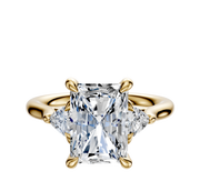 A 14K yellow gold engagement ring with a large rectangular center stone and two trillion-cut side diamonds (total 0.125TCW), shown on a plain white background.