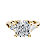 The 18K Yellow Gold 3-Stone Pear Side Stones 0.125TCW Engagement Ring features a large center diamond with two pear-shaped side diamonds, set on a polished gold band.
