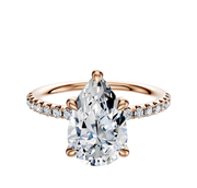 The 14K Rose Gold 4 Prong Hidden Halo Classic Dome 1-Row-Pave 2.5mm Engagement Ring features a rose gold band with small round diamonds set in a classic dome pave design.