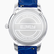 The 38MM Swiss Made Stainless Steel watch features a diamond-encrusted silver case, blue topaz hour markers, textured silver geometric dial with the EAFY logo, and a blue leather strap for a luxurious finish.