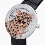 The 39MM Swiss Made Stainless Steel Signature Panther Watch with Diamonds features a jeweled panther design on the dial, gold and diamond accents, green gemstone eyes, and a black leather strap.