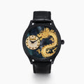 The 41MM Swiss Made Black PVD Dragon Watch features a black PVD stainless steel case, diamond accents, Swiss movement, a detailed gold dragon on the dial, and a sleek black background with a black leather strap.
