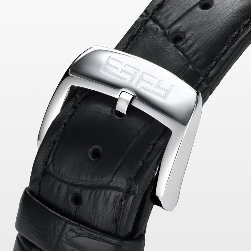 The 41MM Swiss Made Stainless Steel Peacock Watch features diamonds, sapphires, a black leather strap, and a jeweled peacock design with multicolored gemstones and a small round time display on the left side.