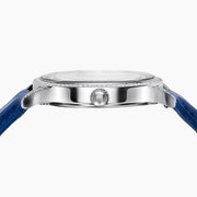 The 41MM Swiss Made Stainless Steel Parrot Watch features a jeweled parrot dial, diamond accents, blue leather strap, and elegant case with emeralds and sapphires—an exquisite statement of luxury and craftsmanship.