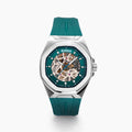 The 42MM Swiss Made Stainless Steel Automatic Skeleton Watch with Diamonds features a teal rubber strap, silver case, partially transparent dial with visible gears, teal bezel and markings, and EBFY branding at the top.