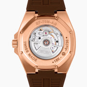 The 42MM Swiss Made 18K Rose Gold Signature Panther Automatic Watch features a brown rubber strap, brown dial with a geometric panther face, diamond markers, green gemstone eyes, and the EARLY name for timeless elegance.