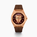 The 42MM Swiss Made 18K Rose Gold Signature Panther Automatic Watch features a brown rubber strap, brown dial with a geometric panther face, diamond markers, green gemstone eyes, and the EARLY name for timeless elegance.