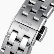A 42MM Swiss made titanium automatic skeleton watch featuring a geometric bezel that reveals intricate gears and movements beneath the dial, complemented by a metal link bracelet.