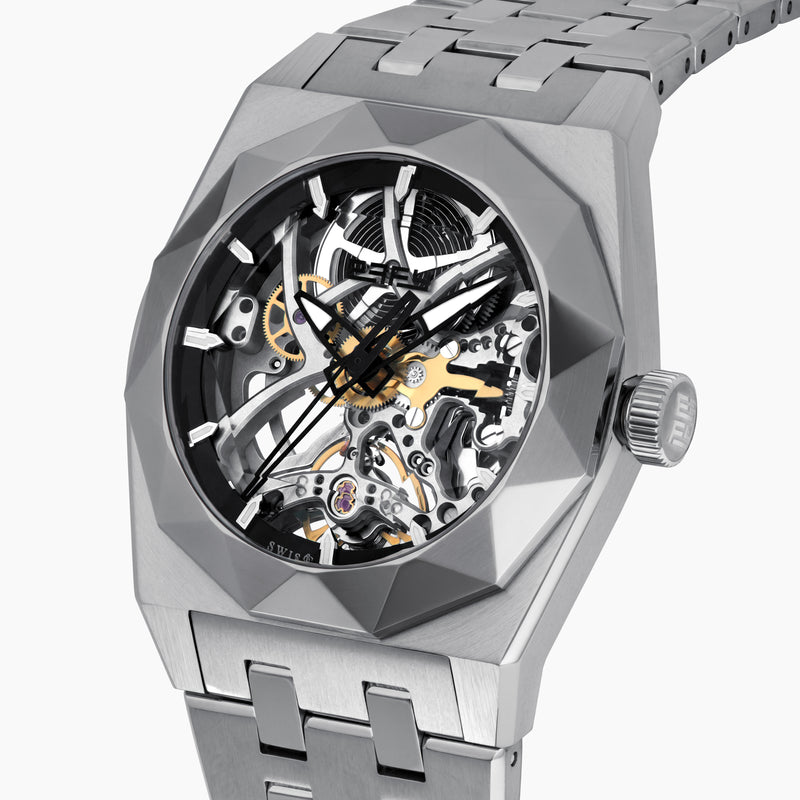 A 42MM Swiss made titanium automatic skeleton watch featuring a geometric bezel that reveals intricate gears and movements beneath the dial, complemented by a metal link bracelet.