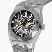A 42MM Swiss made titanium automatic skeleton watch featuring a geometric bezel that reveals intricate gears and movements beneath the dial, complemented by a metal link bracelet.