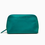 The Effy 2-Piece Travel Pouch set—two teal vegan leather pouches (one large, one small) with embossed logos—is displayed on a white drawstring bag with a matching logo, all set against a plain white background.