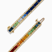 The Watercolors Sapphire and Diamond Bracelet, 9.16 TCW, showcases two rows: one sparkling with diamonds and the other with sapphires and multicolored gems in a rainbow gradient set in a continuous loop.