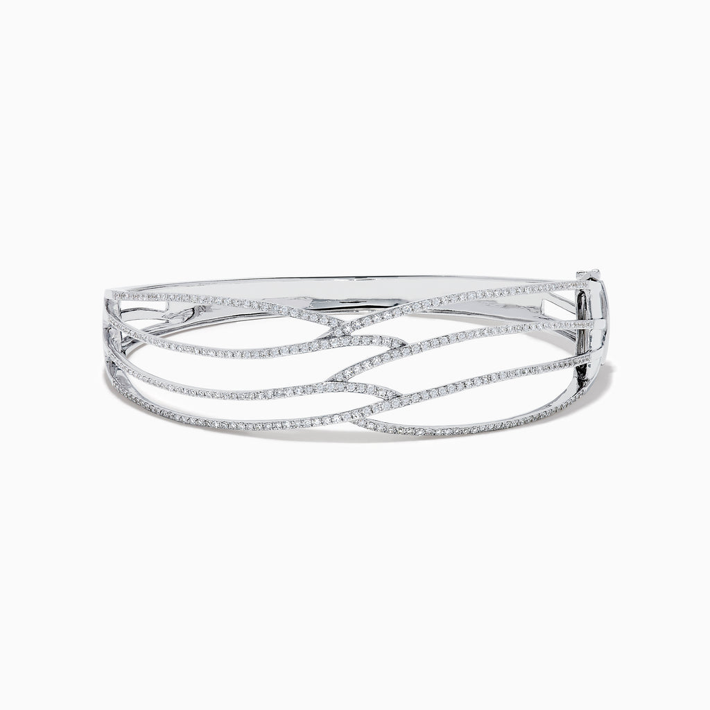 The 14K White Gold Pave Diamond Crisscross Bangle features an open, wavy design adorned with sparkling diamonds along the curves for an elegant, delicate look.