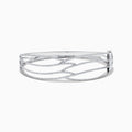 The 14K White Gold Pave Diamond Crisscross Bangle features an open, wavy design adorned with sparkling diamonds along the curves for an elegant, delicate look.