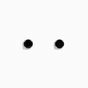 A pair of 14K White Gold Blue Sapphire Stud Earrings, 1.14 TCW, with simple silver prongs is displayed against a plain white background.