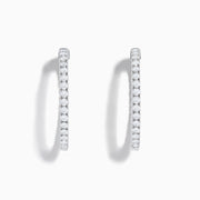 The 14K White Gold Inside Out Diamond Hoop Earrings (2.00 TCW) are shown vertically on a plain white background, with their shadows cast to the side.