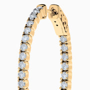 A pair of 14K Yellow Gold Inside Out Diamond Oval Earrings, 2.00 TCW, featuring small round diamonds and displayed against a plain white background.