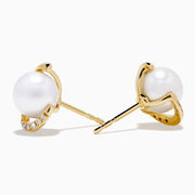 14K Yellow Gold Cultured Pearl and Diamond Stud Earrings featuring round cultured pearls at the center and a curved row of sparkling diamonds on one side, shown against a plain white background.