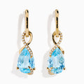 Ocean Bleu 14K Yellow Gold Blue Topaz and Diamond Pear Dangle Earrings feature teardrop-shaped blue topaz gemstones accented with a curved line of sparkling diamonds.