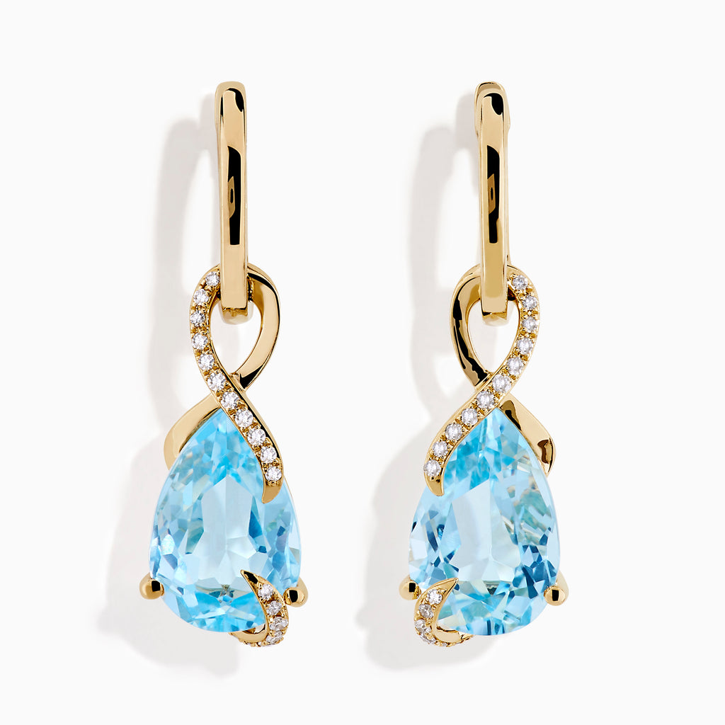 Ocean Bleu 14K Yellow Gold Blue Topaz and Diamond Pear Dangle Earrings feature teardrop-shaped blue topaz gemstones accented with a curved line of sparkling diamonds.