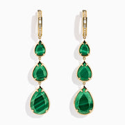 The 14K Yellow Gold Malachite and Diamond Linear Drop Pear Earring features three vertically arranged, teardrop-shaped green malachite stones in gold bezels, accented with diamonds and displayed on a white background.