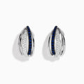 The Royale Bleu 14K White Gold Blue Sapphire & Diamond Earrings (0.62 TCW) feature intersecting bands—one adorned with white diamonds, the other with blue sapphires—shown on a white background.