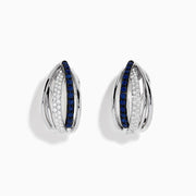 The Royale Bleu 14K White Gold Blue Sapphire & Diamond Earrings (0.62 TCW) feature intersecting bands—one adorned with white diamonds, the other with blue sapphires—shown on a white background.