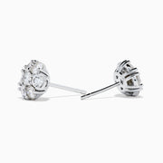 The 14K White Gold Diamond Bouquet Stud Earrings feature a floral cluster design with multiple round diamonds set closely together against a white gold background.