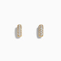 A pair of 14k Yellow Gold Diamond Huggie Earrings, each adorned with rows of sparkling diamonds, showcased against a plain white background.