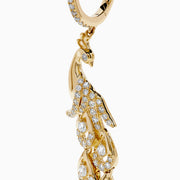 The 14K Yellow Gold Diamond Peacock Drop Earrings feature a peacock design with sparkling diamonds on the head, body, and tail feathers for a luxurious and elegant style.