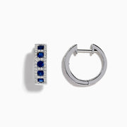 The Royale Bleu 14K White Gold Sapphire & Diamond Hoop Earrings, 1.03 TCW, showcase rows of sapphires bordered by diamond accents, elegantly displayed against a white background.