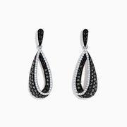 These 14K White Gold Black and White Diamond Earrings (1.30 TCW) feature elegant interlocking teardrop shapes adorned with sparkling diamond accents.