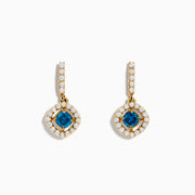 14K Yellow Gold Blue and White Diamond Dangle Earrings featuring a central blue gem encircled by a halo of white diamonds, with extra diamonds along the hooks, displayed on a white background.
