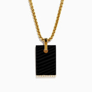 The Mens 14K Yellow Gold Diamond and Carved Onyx Pendant features a rectangular onyx with a gold attachment and a row of sparkling diamonds along the bottom edge, suspended from a gold chain necklace.