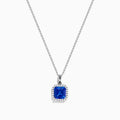 The Nahla Siri 14K Gold Tanzanite and Diamond Pendant features a square blue tanzanite gemstone surrounded by sparkling diamonds, displayed against a white background.