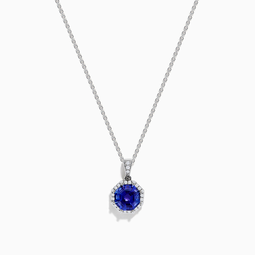 The Nahla Siri 14K Gold pendant showcases an octagon-cut tanzanite with a deep blue hue, surrounded by sparkling diamonds in a geometric setting.