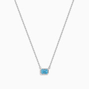 The Lab Grown Blue Diamond Necklace in 14K White Gold features a rectangular emerald-cut lab-grown blue diamond pendant in a simple bezel setting on a delicate white gold chain.