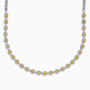 The Canare 18K Two Tone Gold White and Yellow Diamond Necklace showcases square yellow diamonds, each framed by small white diamonds, evenly set along the chain for a refined two-tone gold effect.