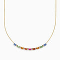 The Watercolors 14K Yellow Gold Multi Sapphire and Diamond Necklace features a delicate gold chain with a gradient row of rectangular multicolored sapphires and diamond accents, displayed on a white background.