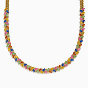 The Watercolors 14K Yellow Gold Multi Sapphire Necklace features a repeating pattern of small marquise-shaped sapphires in red, blue, green, orange, and pink set along the entire chain.