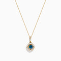 The 14K Yellow Gold Blue and White Diamond Halo Pendant features a round blue gemstone centerpiece surrounded by sparkling white diamonds, all set on a delicate fine chain.