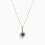 The 14K Yellow Gold Blue and White Diamond Halo Pendant features a round blue gemstone centerpiece surrounded by sparkling white diamonds, all set on a delicate fine chain.