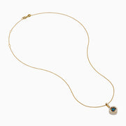 The 14K Yellow Gold Blue and White Diamond Halo Pendant features a round blue gemstone centerpiece surrounded by sparkling white diamonds, all set on a delicate fine chain.
