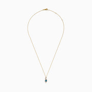 The 14K Yellow Gold Blue and White Diamond S-Curve Halo Pendant features a marquise-shaped blue and white diamond with small white stones in a symmetrical halo on a gold chain necklace.