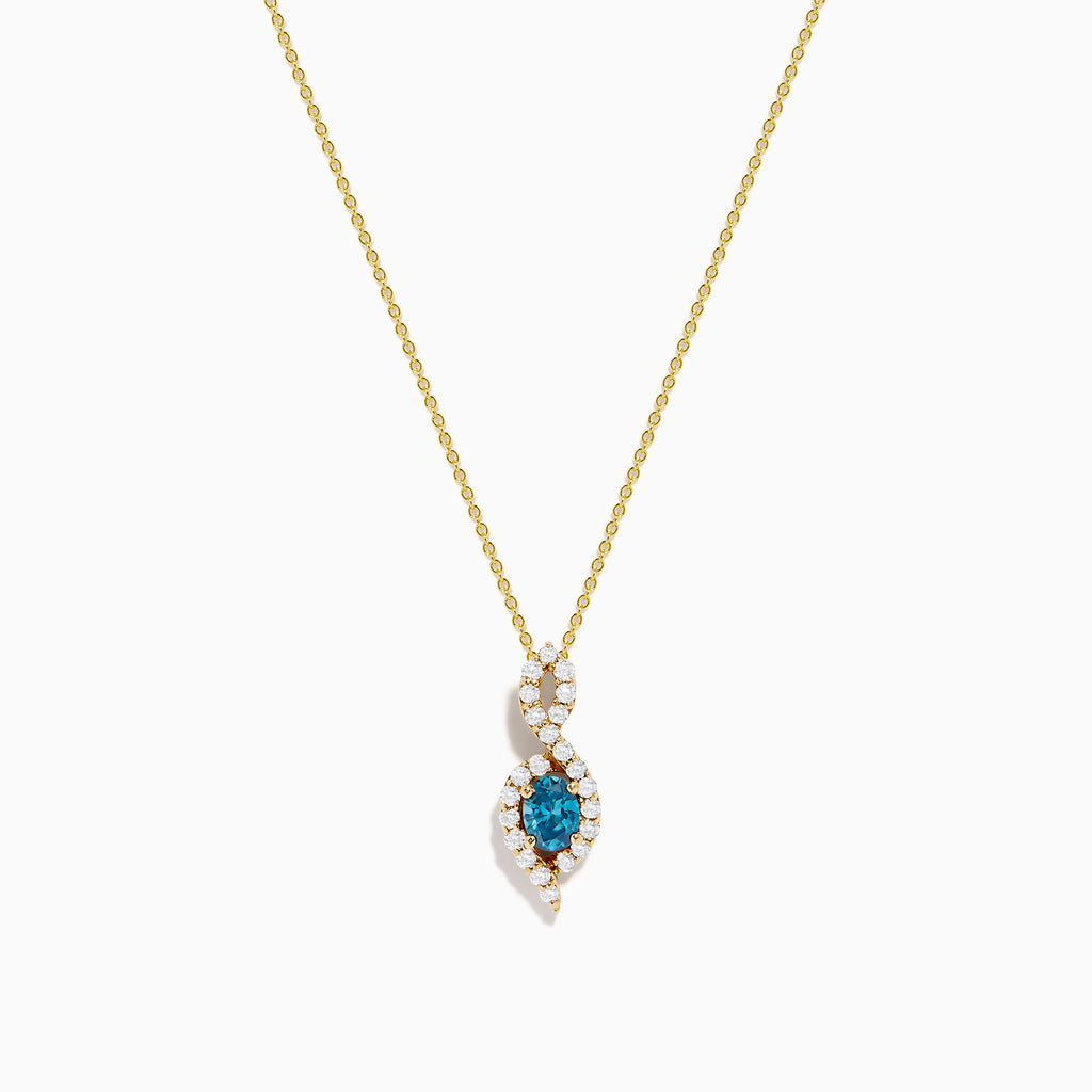 The 14K Yellow Gold Blue and White Diamond S-Curve Halo Pendant features a marquise-shaped blue and white diamond with small white stones in a symmetrical halo on a gold chain necklace.