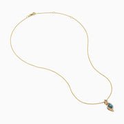 The 14K Yellow Gold Blue and White Diamond S-Curve Halo Pendant features a marquise-shaped blue and white diamond with small white stones in a symmetrical halo on a gold chain necklace.