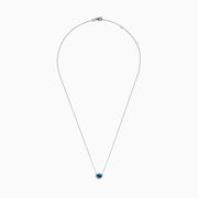 The 14K White Gold Pear Shaped Blue Diamond Necklace features a pear-cut blue diamond pendant in a minimalist setting, crafted from 14K white gold and showcased on a white background.
