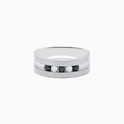 The Mens Sterling Silver Black and White Diamond Ring, 0.50 TCW, features a flat band with alternating black and white diamonds set in a striking central row.